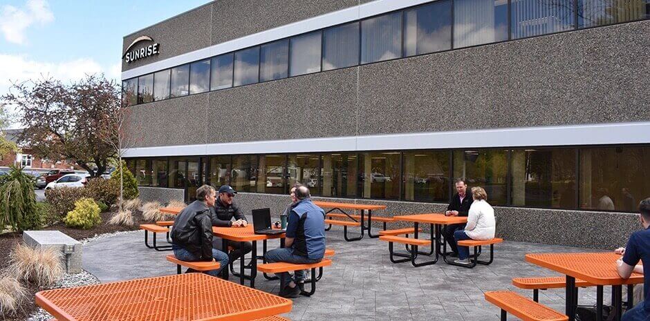 people sitting at an outside table