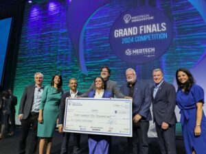 Samay accepting prize check at MedTech Innovator