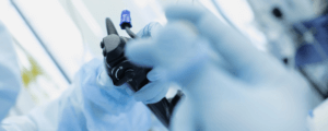 Medical device being held by gloved hands