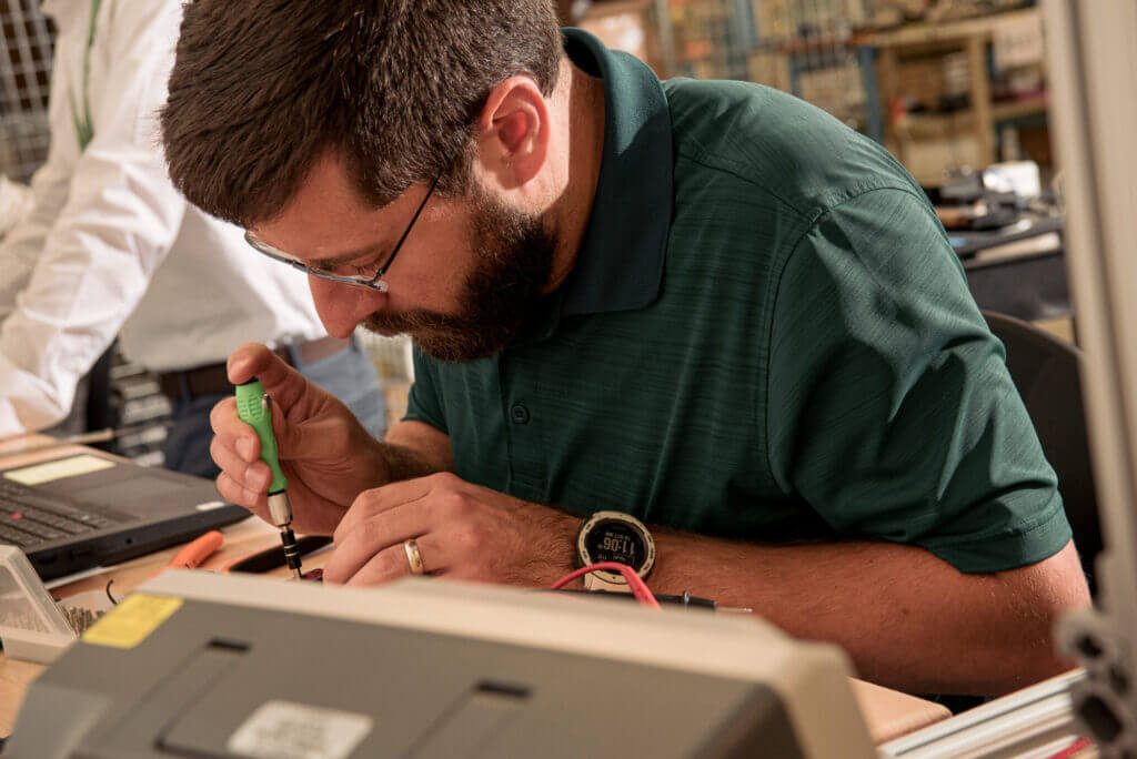Man working on small device