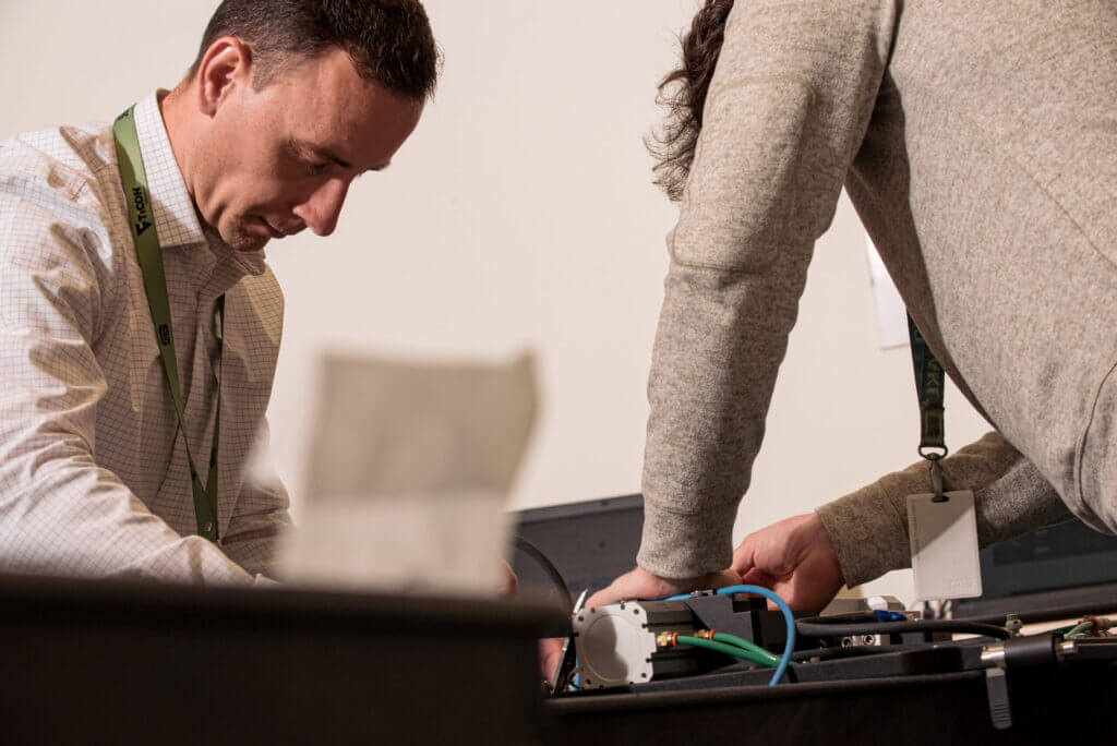 two people working on a medical device together